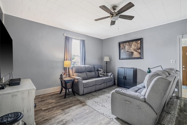 living room with wood-type flooring and ceiling fan