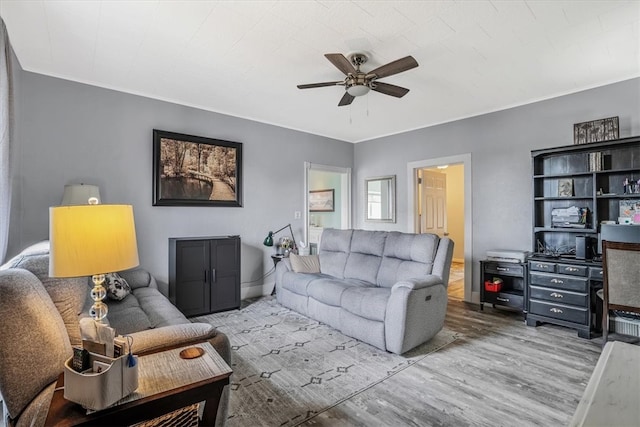 living room with hardwood / wood-style flooring and ceiling fan