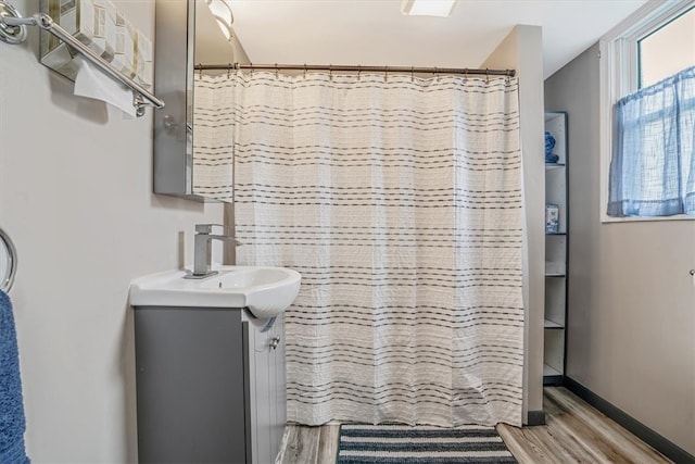 bathroom with vanity and wood-type flooring