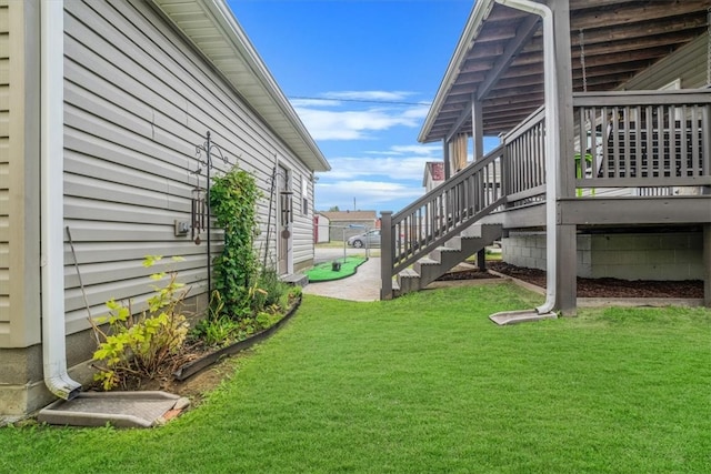 view of yard featuring a wooden deck