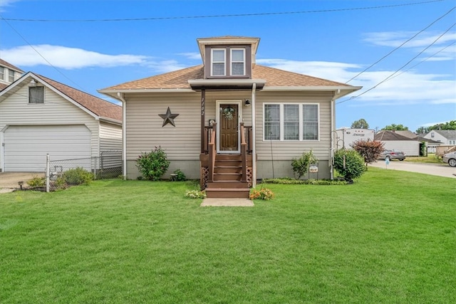 bungalow with a garage and a front yard