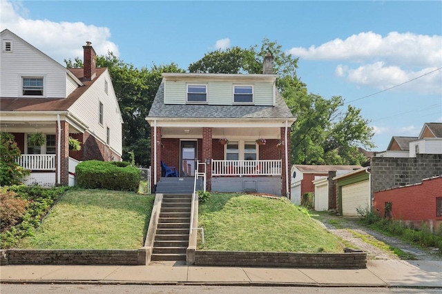 view of property featuring a porch and a front yard