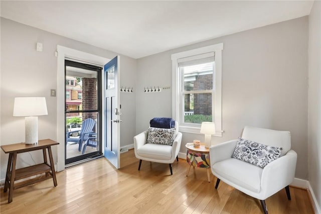 living area with light hardwood / wood-style floors