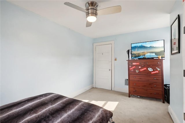 bedroom with light carpet and ceiling fan