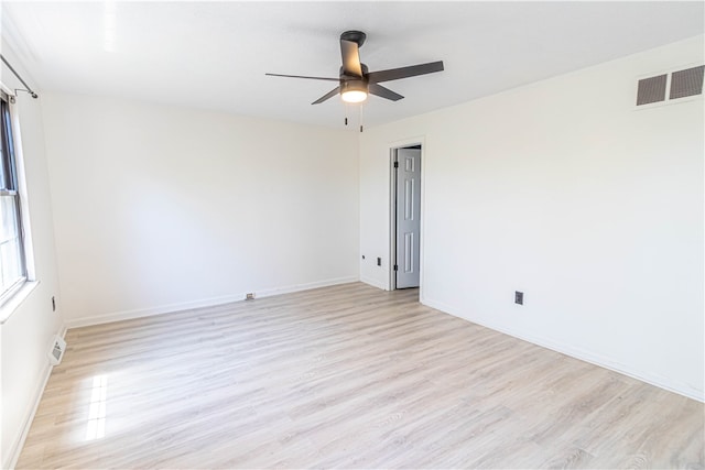 unfurnished room with light wood-type flooring and ceiling fan