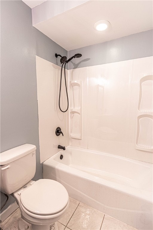 bathroom featuring toilet, shower / tub combination, and tile patterned flooring