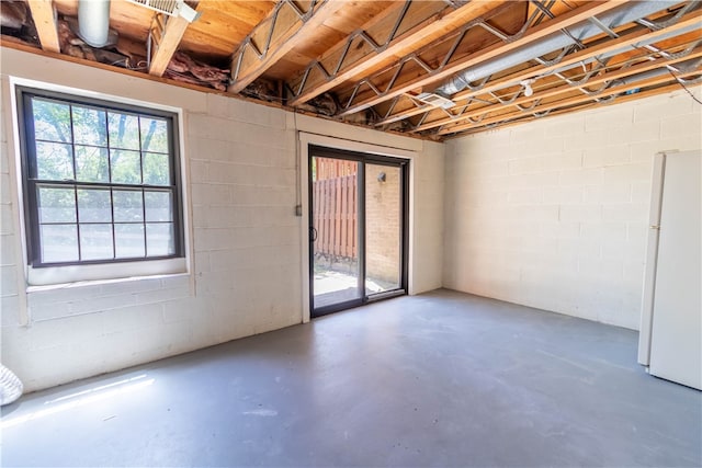 basement with white fridge