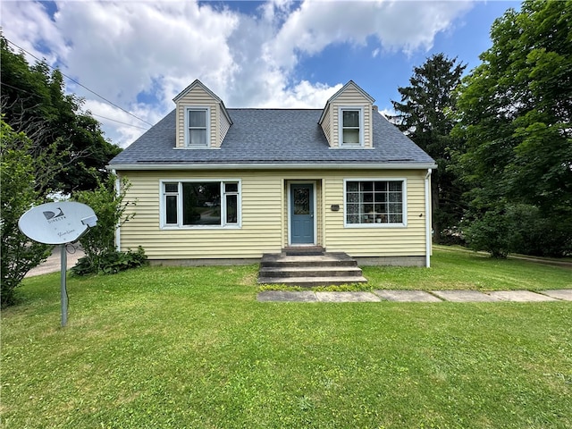 cape cod house featuring a front lawn