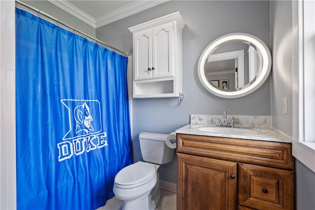 bathroom with vanity, toilet, tile patterned floors, and ornamental molding