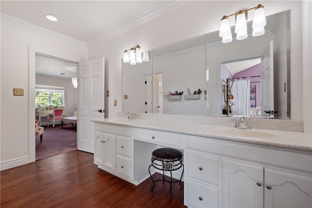 bathroom with vanity, crown molding, hardwood / wood-style floors, and lofted ceiling