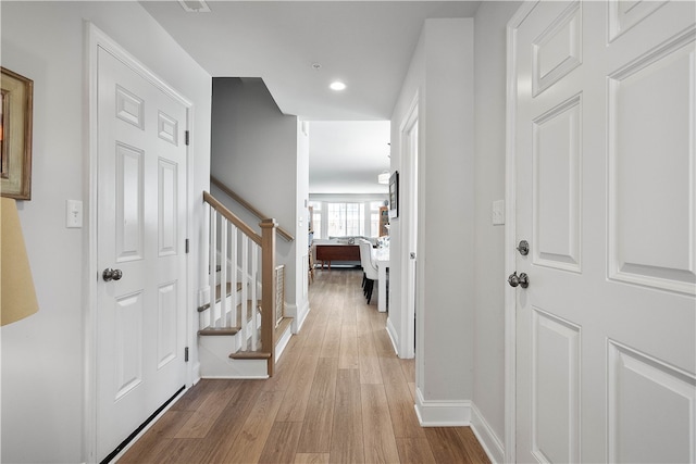 corridor featuring light hardwood / wood-style flooring