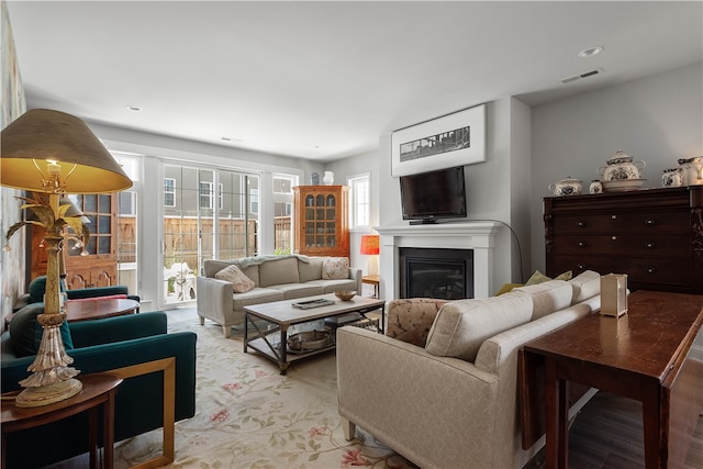 living room featuring light hardwood / wood-style flooring and a wealth of natural light