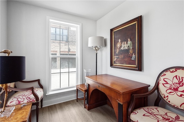 office area with a healthy amount of sunlight and light hardwood / wood-style flooring