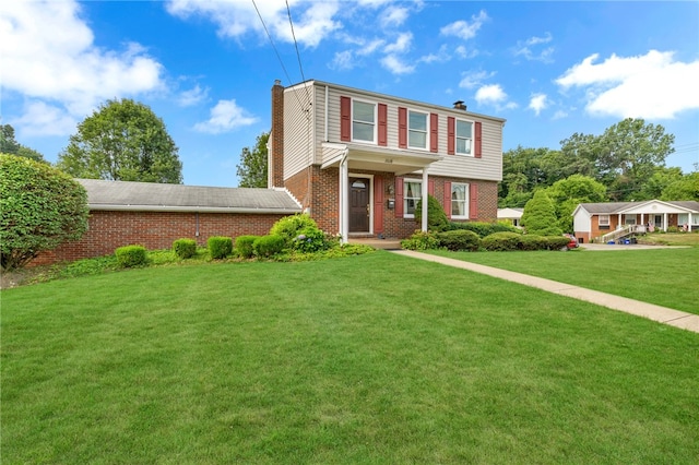 view of front of home with a front yard