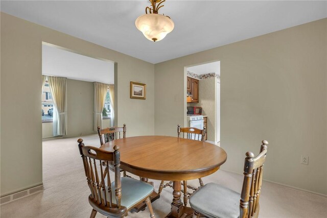 view of carpeted dining area