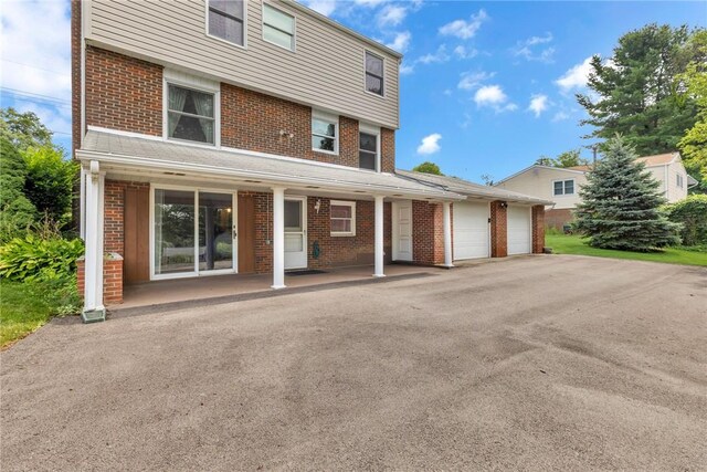 view of front of property with a garage and a porch