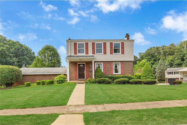 view of front of home featuring a front yard