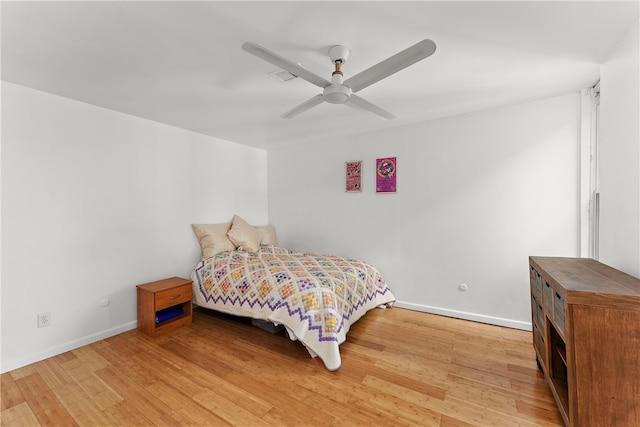 bedroom featuring light hardwood / wood-style flooring and ceiling fan