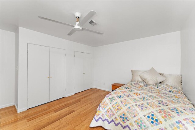 bedroom with light wood-type flooring and ceiling fan