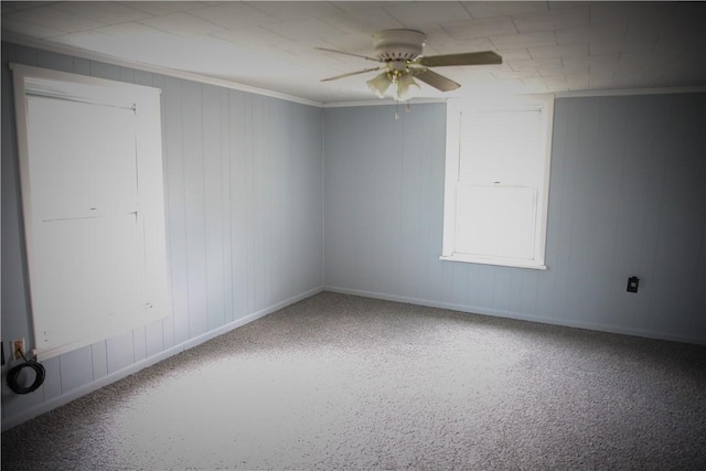 unfurnished room with ceiling fan and ornamental molding