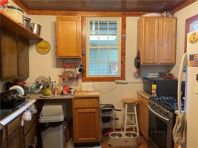 kitchen with light countertops and gas range