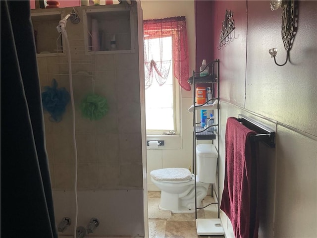 full bath featuring toilet and a shower