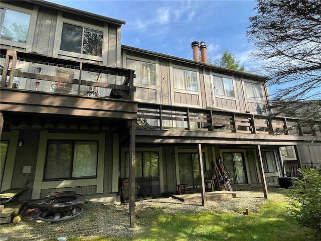 back of house featuring a balcony