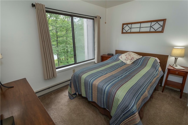 carpeted bedroom with multiple windows and a baseboard heating unit