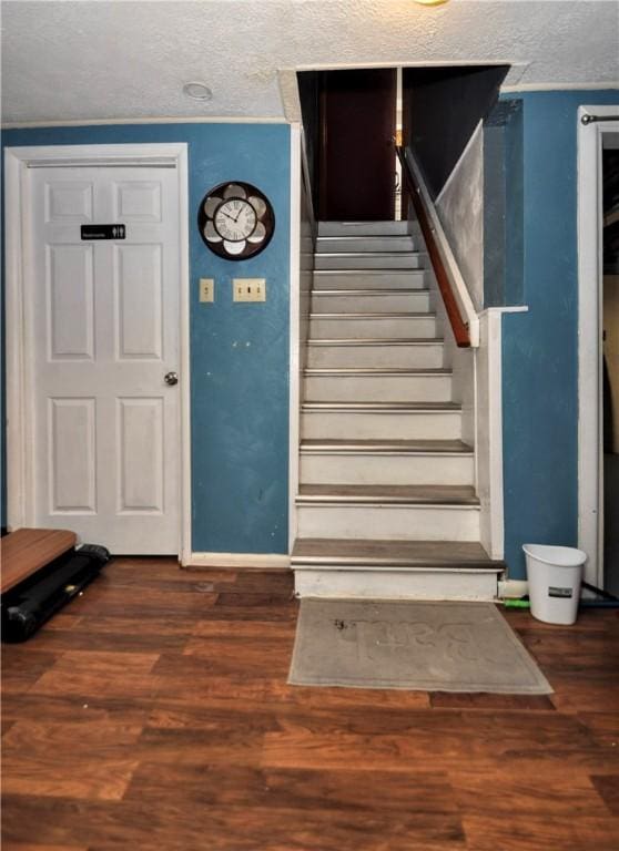 stairs featuring hardwood / wood-style flooring