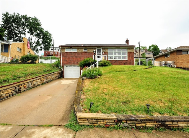 view of front facade featuring a front lawn and a garage