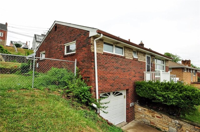 view of side of home with a garage