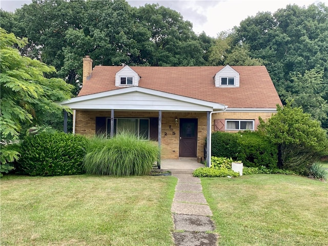 view of front of house with a porch and a front lawn