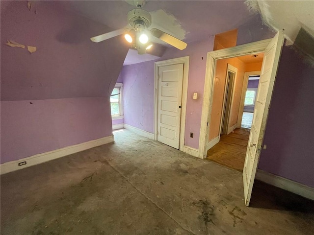 bonus room with lofted ceiling and ceiling fan