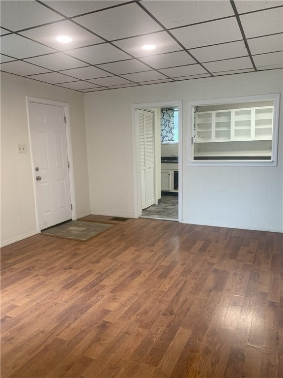 spare room featuring dark wood-type flooring