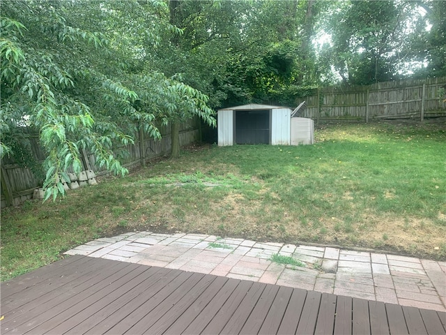 deck featuring a yard and a storage shed