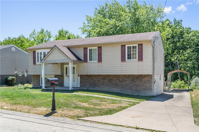 bi-level home with a front lawn