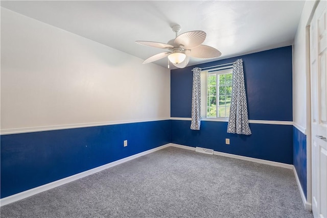 empty room featuring ceiling fan and carpet flooring