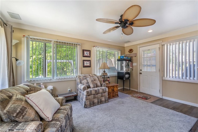 living room with hardwood / wood-style flooring, plenty of natural light, and ceiling fan