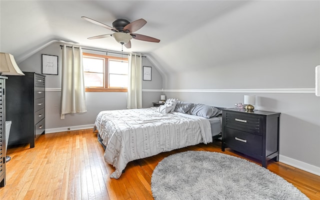 bedroom featuring lofted ceiling, hardwood / wood-style floors, and ceiling fan