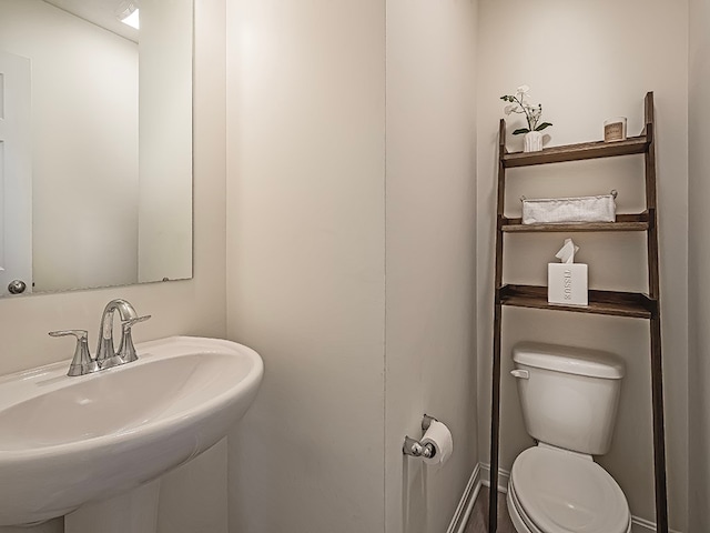 bathroom with toilet and sink