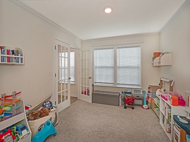 playroom featuring french doors, carpet floors, and ornamental molding