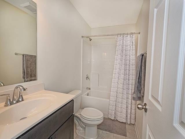 full bathroom featuring vanity, tile patterned flooring, toilet, and shower / bath combo