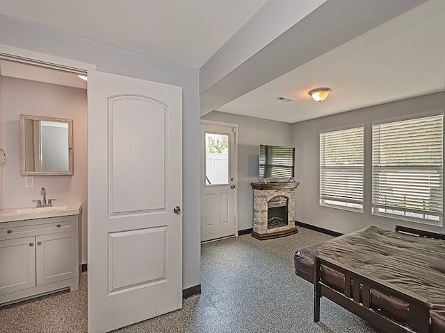 interior space featuring a fireplace and sink