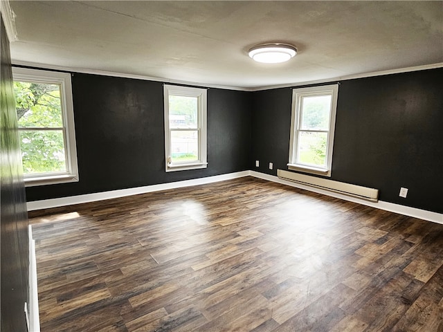 unfurnished room featuring a baseboard radiator, dark hardwood / wood-style floors, and ornamental molding