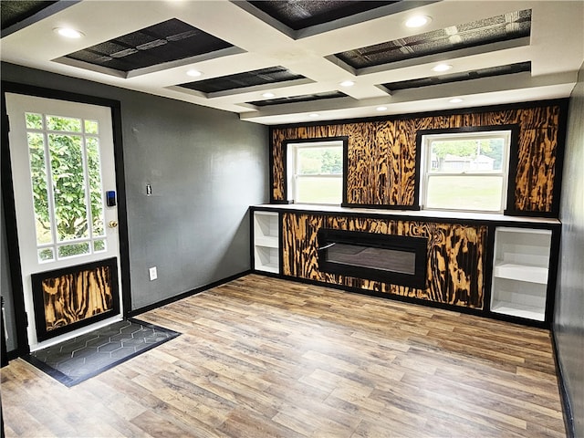 interior space featuring hardwood / wood-style floors and coffered ceiling