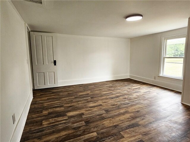 empty room featuring dark hardwood / wood-style floors