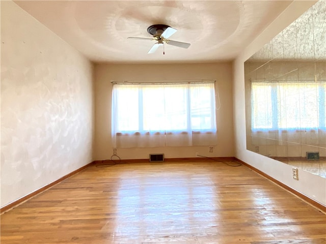 spare room with ceiling fan and light hardwood / wood-style flooring