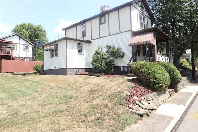 213 2nd St, Elco, PA 15434 - rear view of property featuring board and batten siding and a chimney