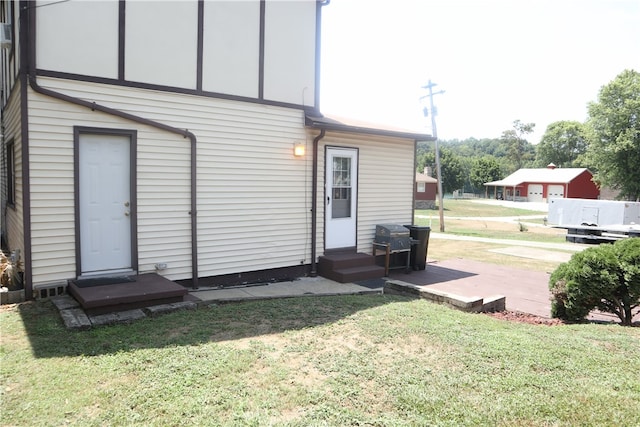 rear view of property with a lawn