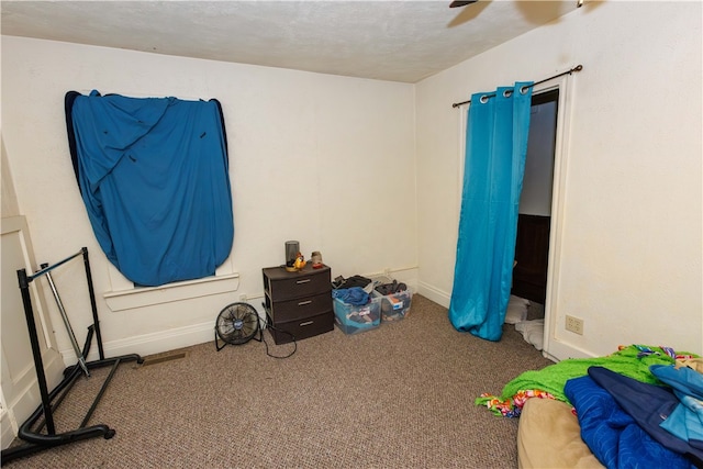 bedroom with ceiling fan and carpet